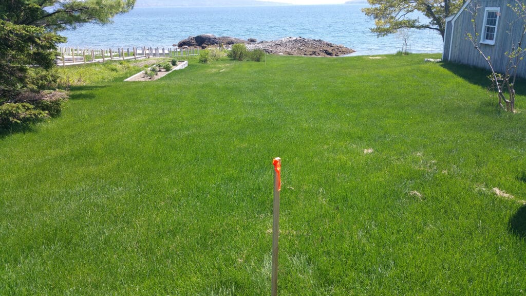 photo of a boundary stake on a lawn