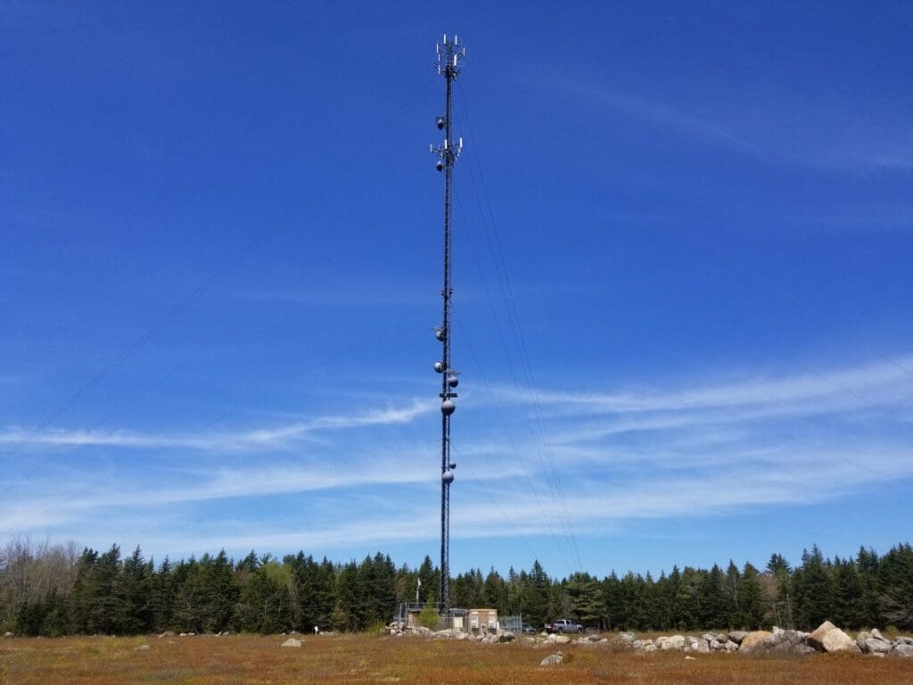 photo of a communications tower in a field