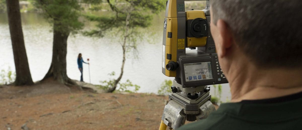 steve salsbury using surveying equipment