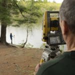 steve salsbury using surveying equipment