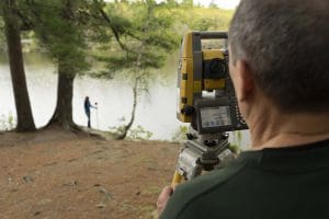 steve salsbury using surveying equipment